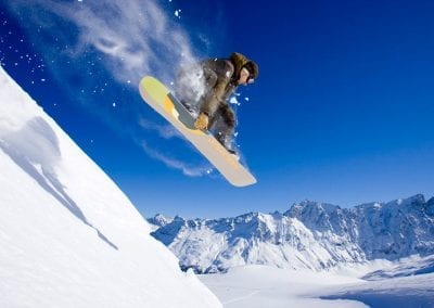 cube snowboarder powder jump
